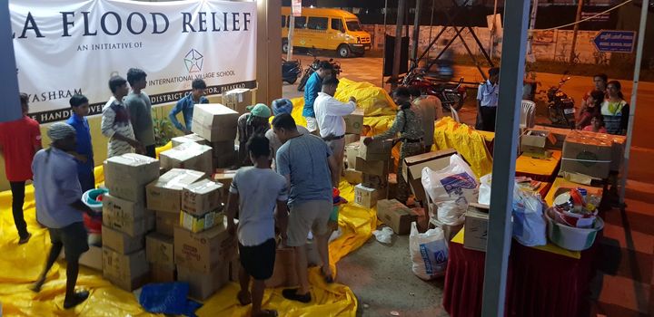 Volunteers and teachers of IVS work together to collect relief materials for flood victims in Kerala.