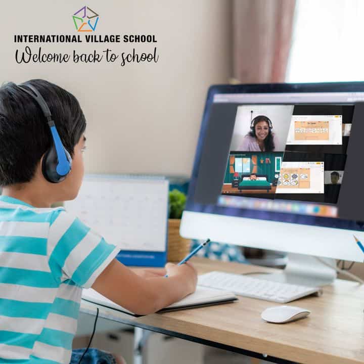 A banner image of a small boy attending online class using a computer illustrate "Welcome back to school".
